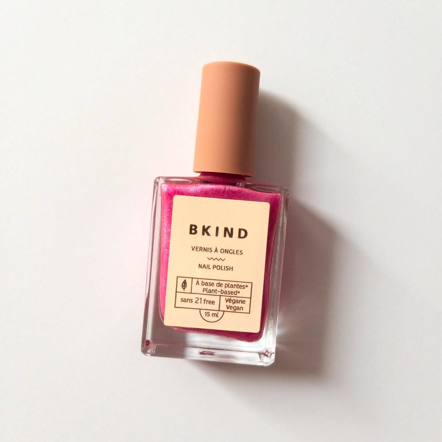 BKIND Britney glitter pink nail polish bottle on white background – Calgary nail polish