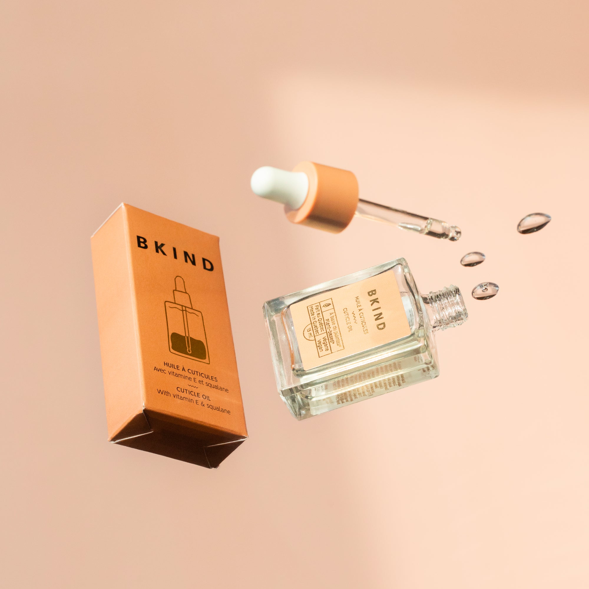 BKIND cuticle oil flatlay with box and dropper – Calgary natural skincare product for healthy nails and soft hands.