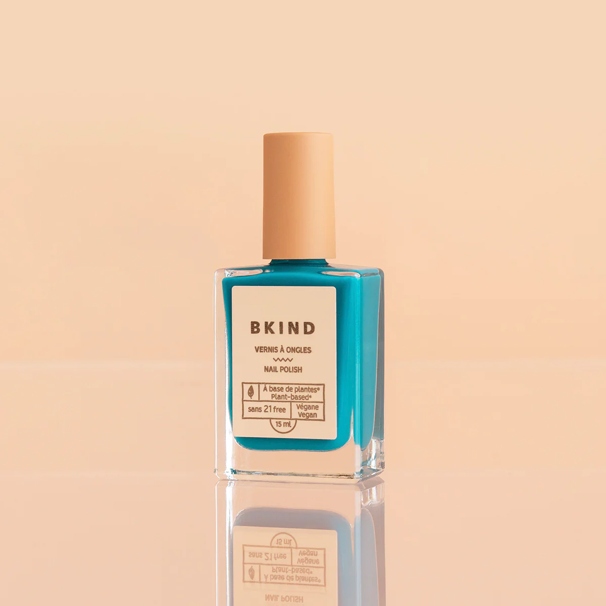 BKIND Poule Party nail polish bottle on peach background