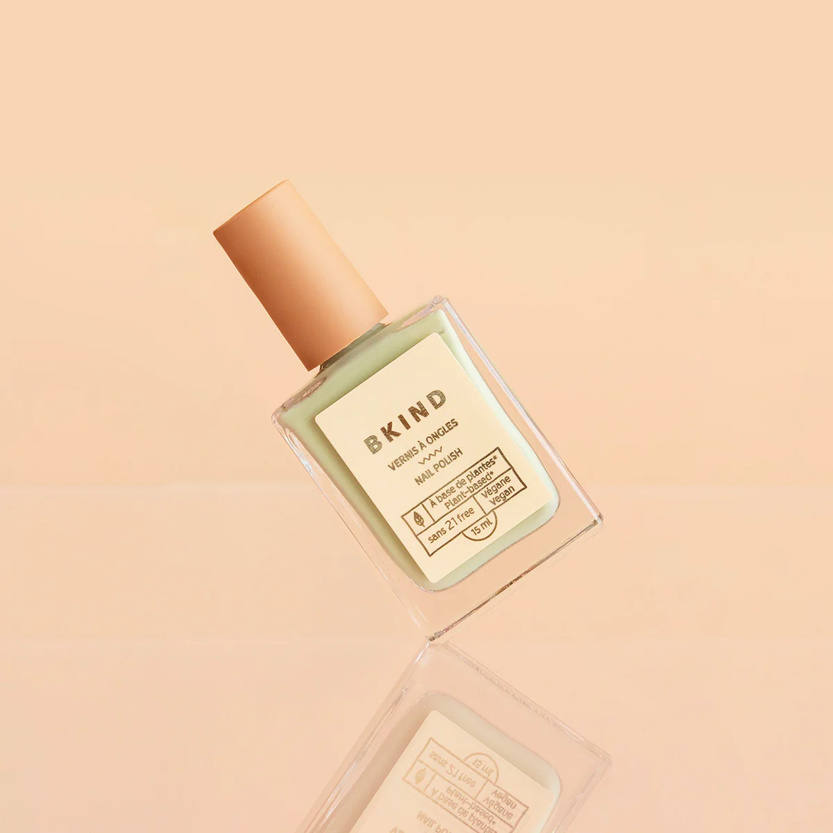 BKIND Nail Polish in White Lies on peach background
