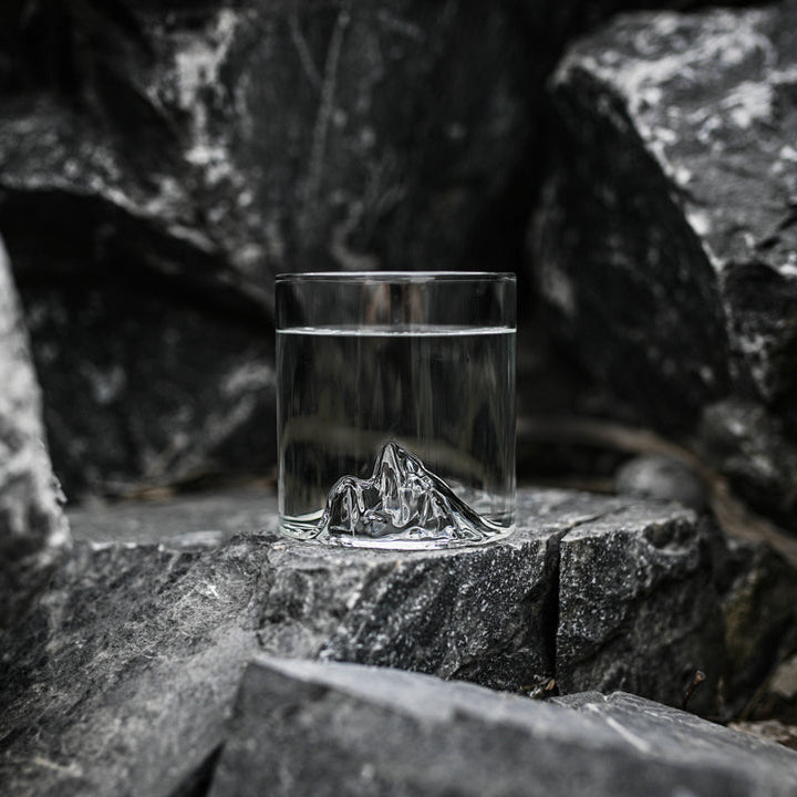 MTNPK Black Tusk tumbler on dark rocky surface, filled with water, Calgary mountain glassware from Greenbriar Market