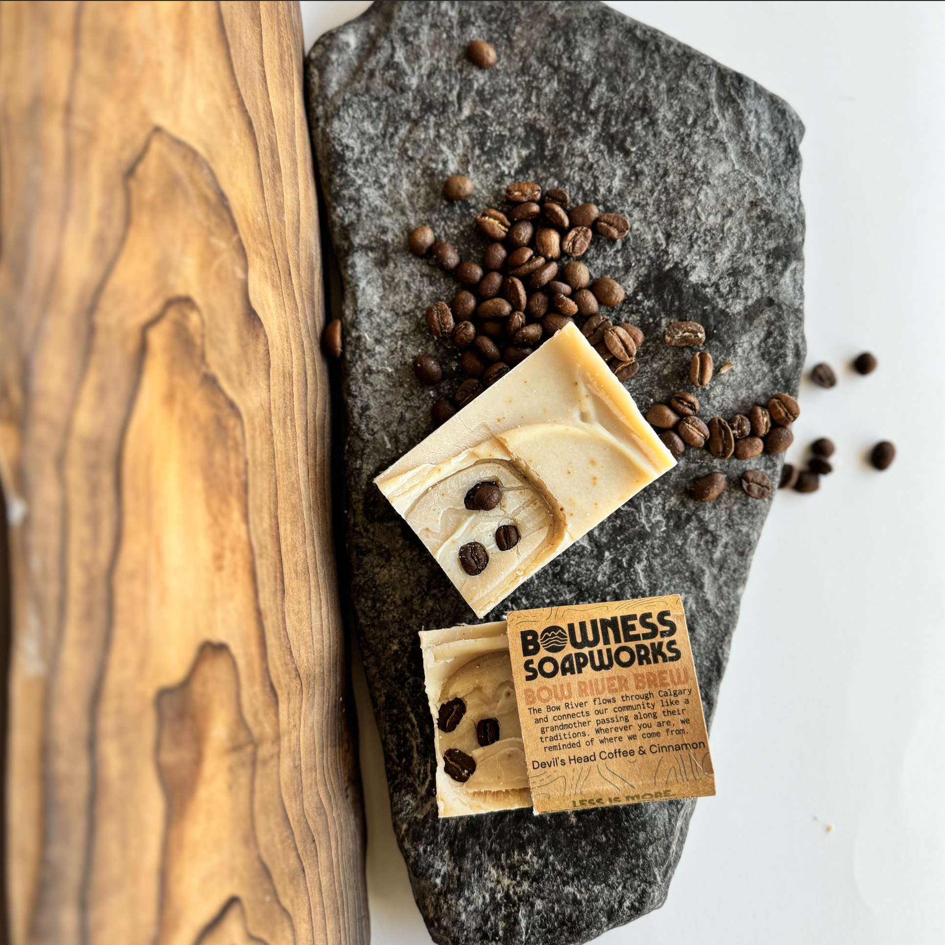 Calgary coffee soap with whole beans, handmade by Bowness Soapworks, flat lay on stone