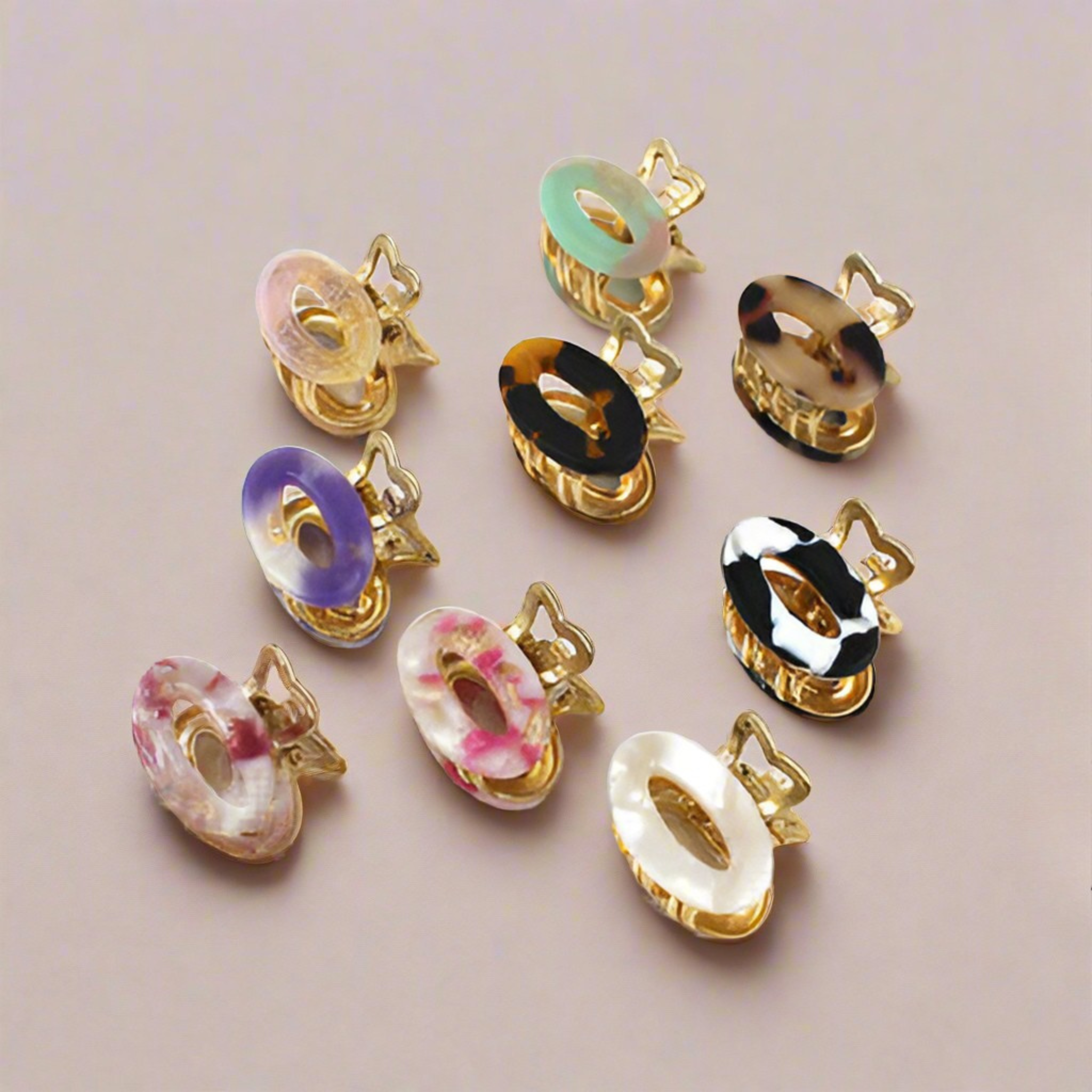 Charlotte mini hair clips in assorted colours displayed on a blush background – Calgary hair accessories collection.