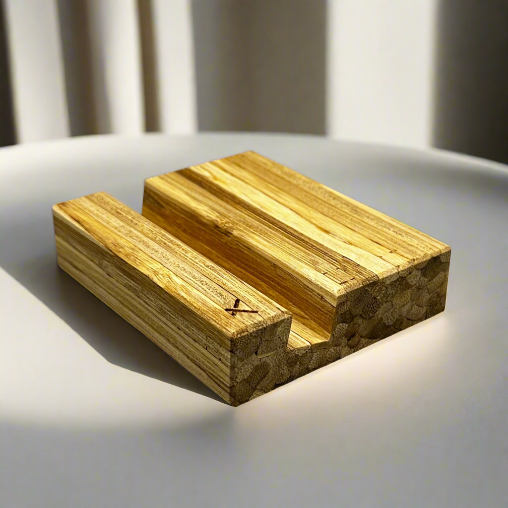 Side view of eco-friendly ChopValue business card holder on a white desk, showcasing natural bamboo tones.