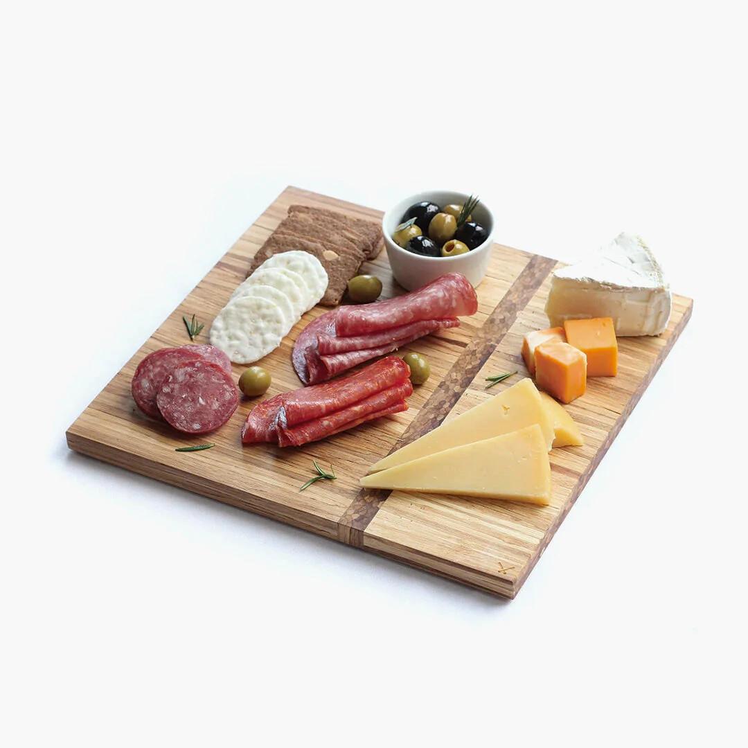 Charcuterie platter made from recycled chopsticks, styled with cheese and wine in Calgary