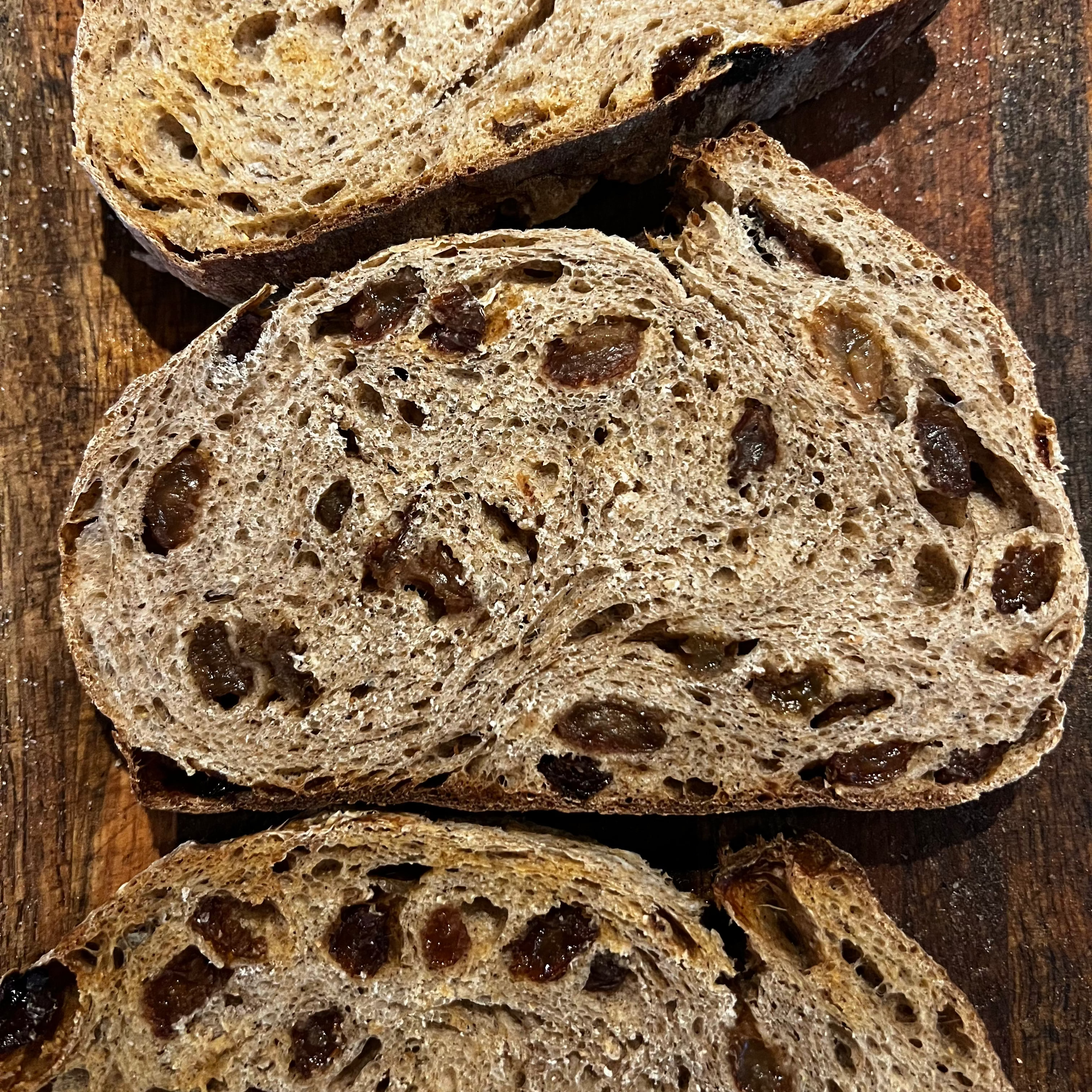 Close-up of cinnamon raisin sourdough slices on wood board in Calgary