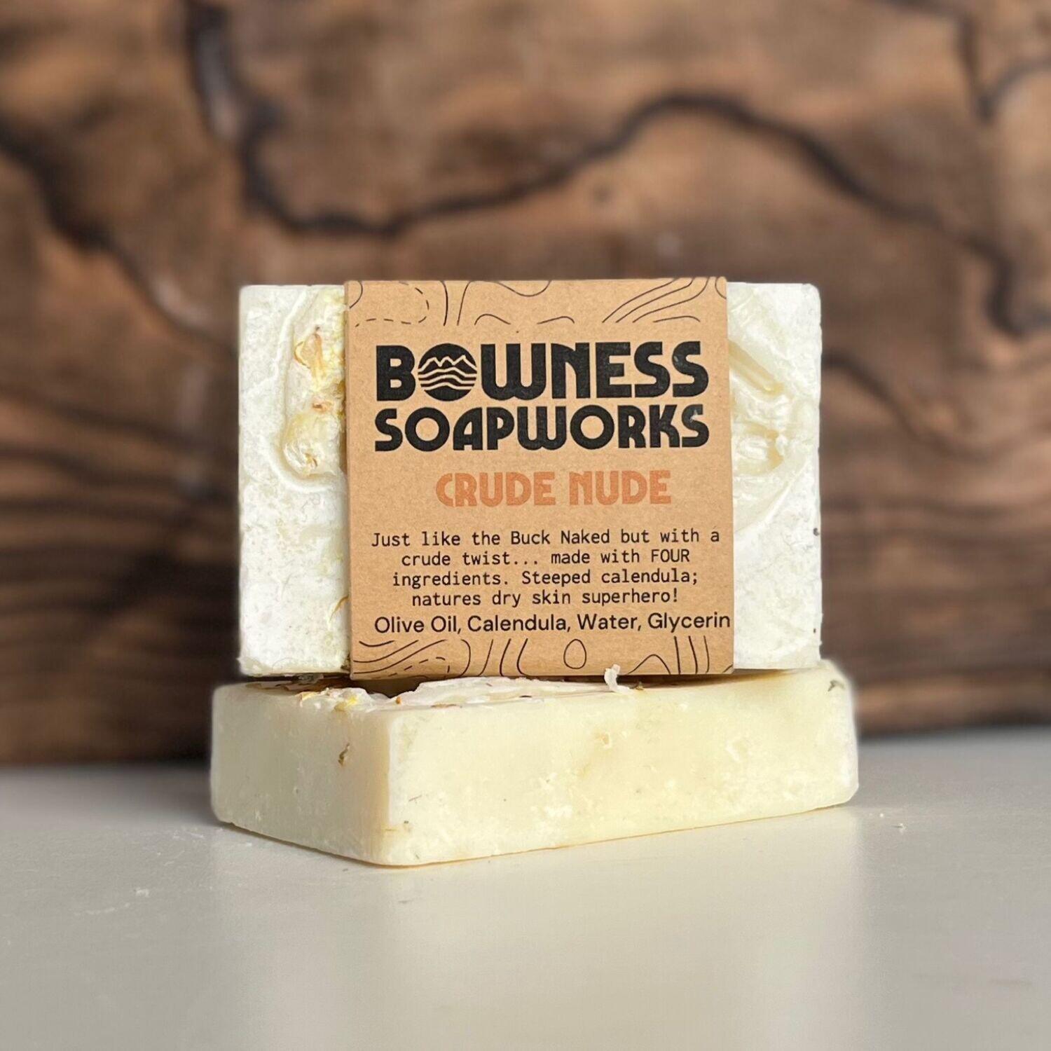 Crude Nude unscented calendula soap by Bowness Soapworks in Calgary, shown stacked with dried petals and kraft label