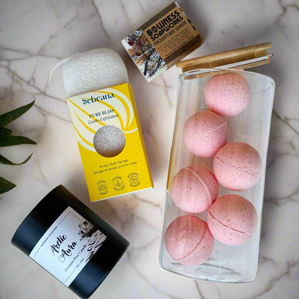Calgary bath gift set with Tropical Twilight bath bombs, Arctic Aura candle, konjac sponge, and handmade soap.