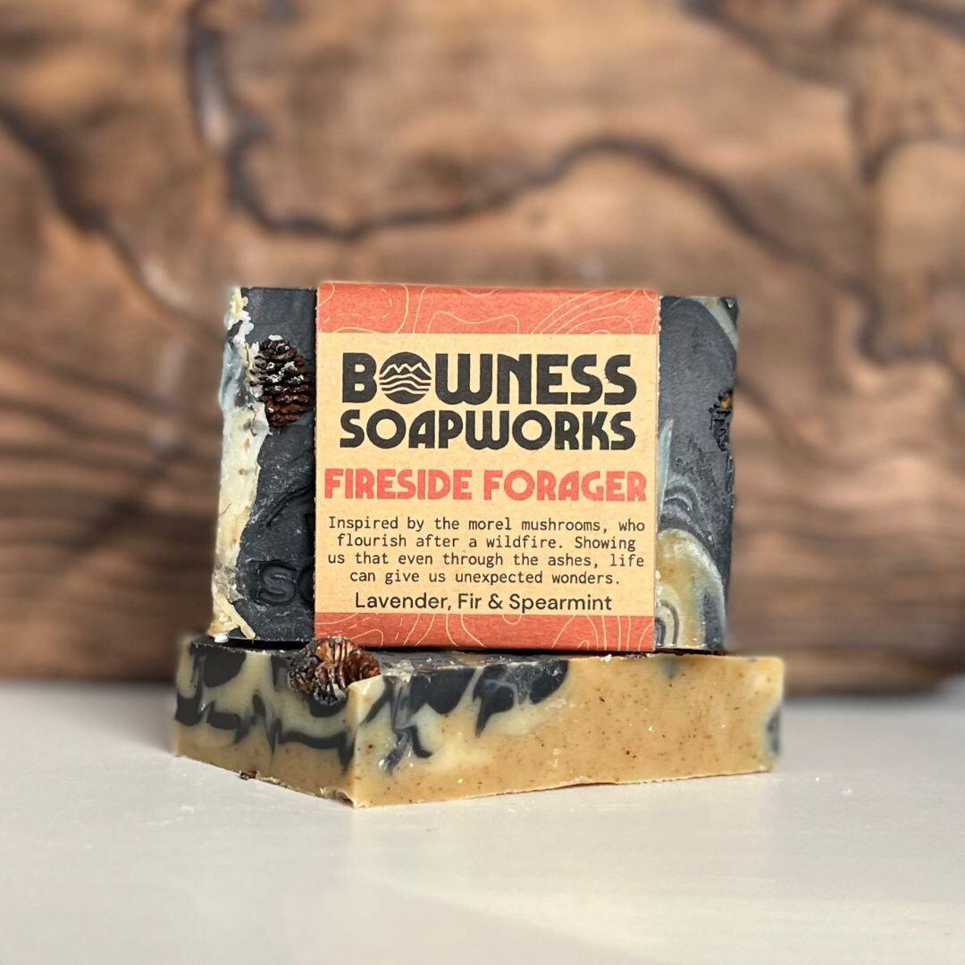 Fireside Forager soap made in Calgary by Bowness Soapworks with fir, spearmint, and lavender, shown with layered swirls and pine cone detail
