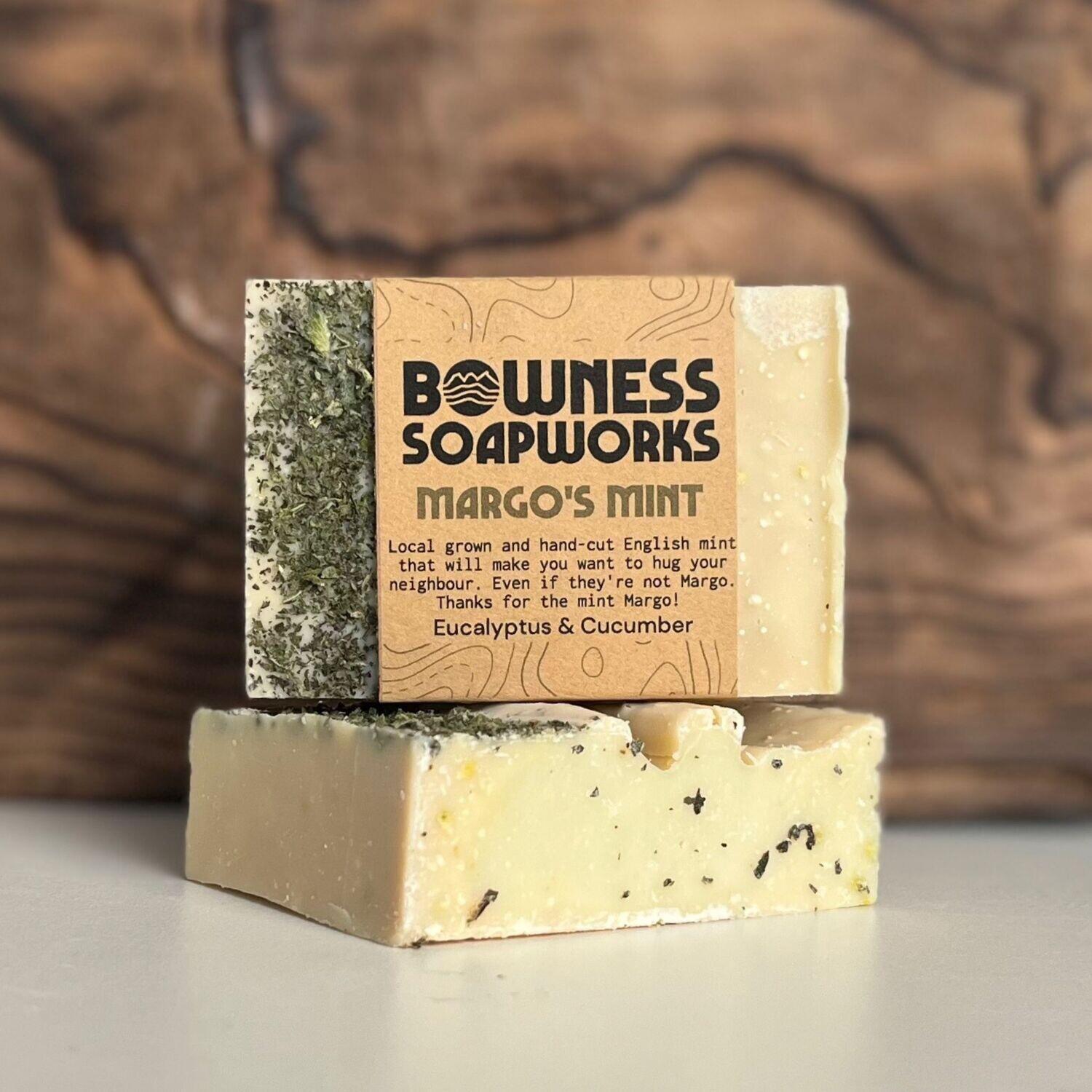 Margo’s Mint soap made in Calgary by Bowness Soapworks with mint, cucumber, and eucalyptus, shown with visible herbs and kraft label