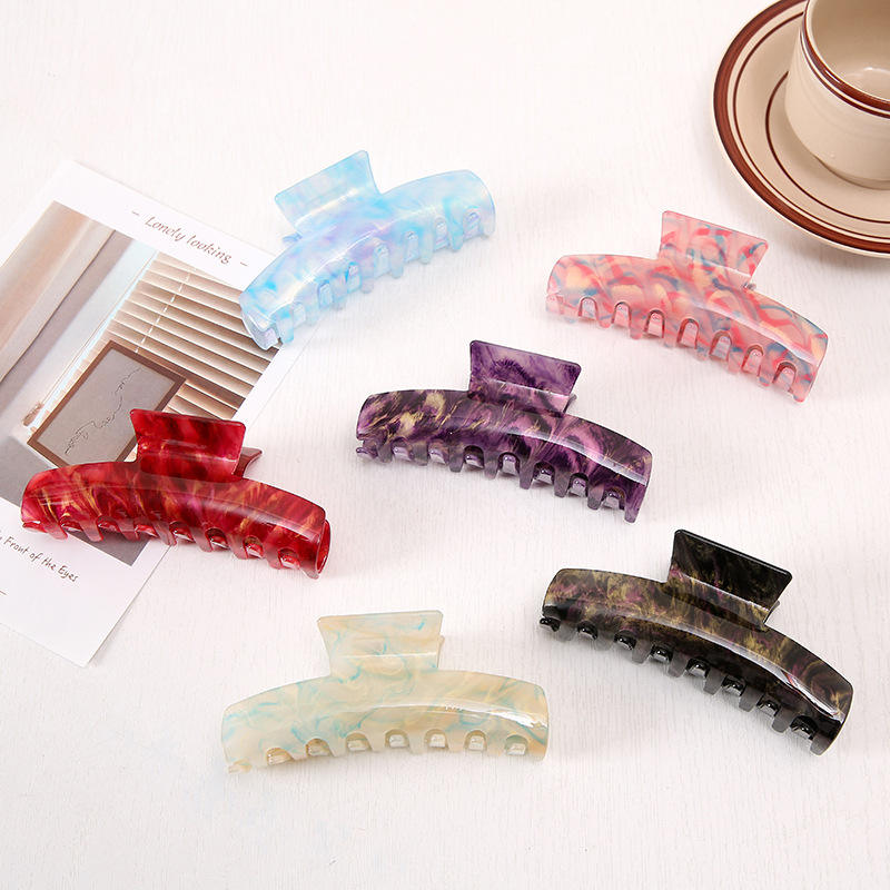 Set of six Sabrina marbled claw clips in assorted colours, available at top Calgary refill + gift shop