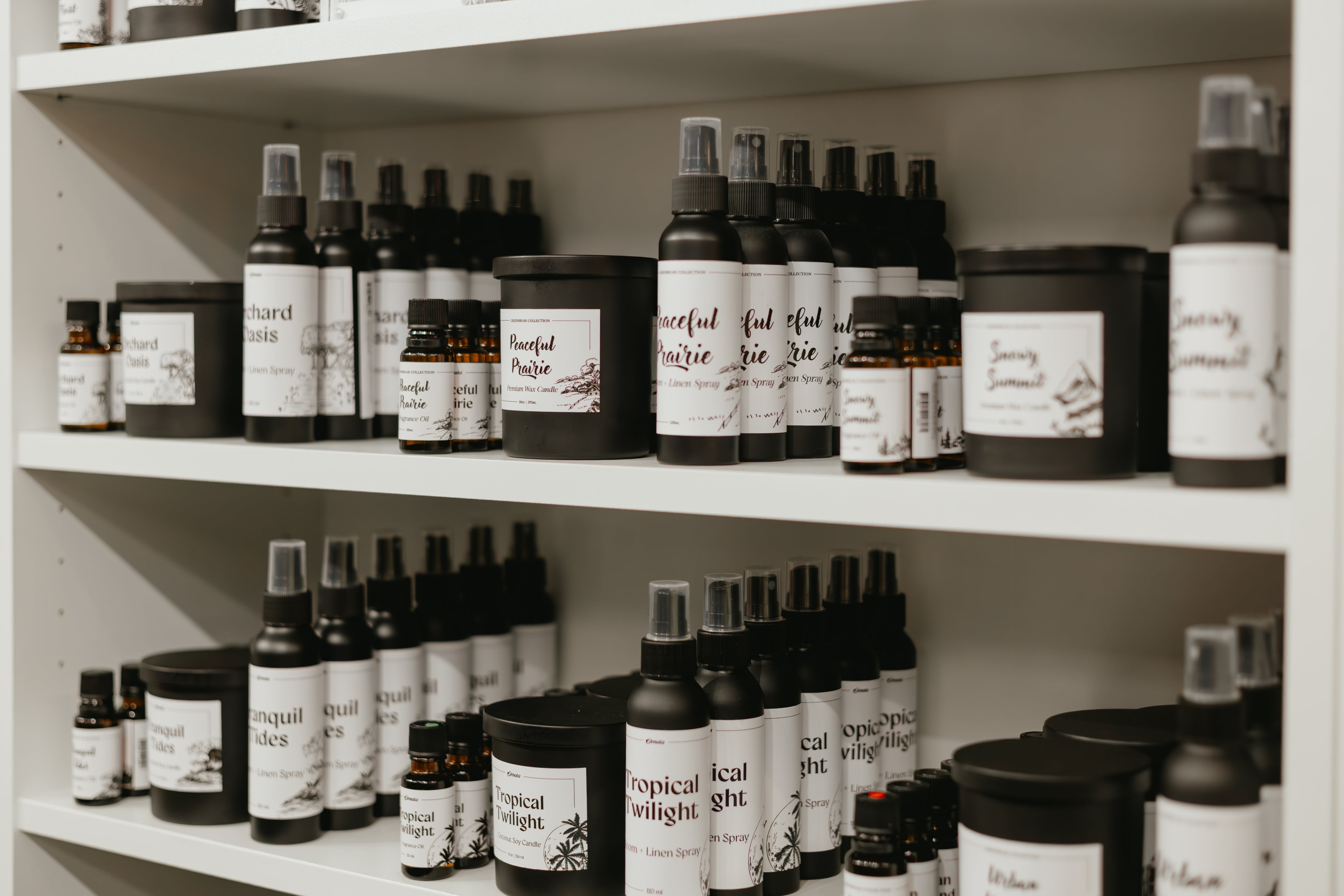 New arrivals displayed on the shelf at Greenbriar Market in Calgary, featuring candles, room sprays, and curated home goods.