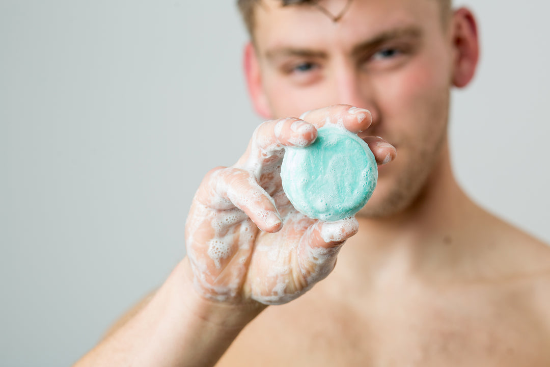 Lathering an Upfront Cosmetics shampoo bar in the shower – sulfate-free hair care in Calgary