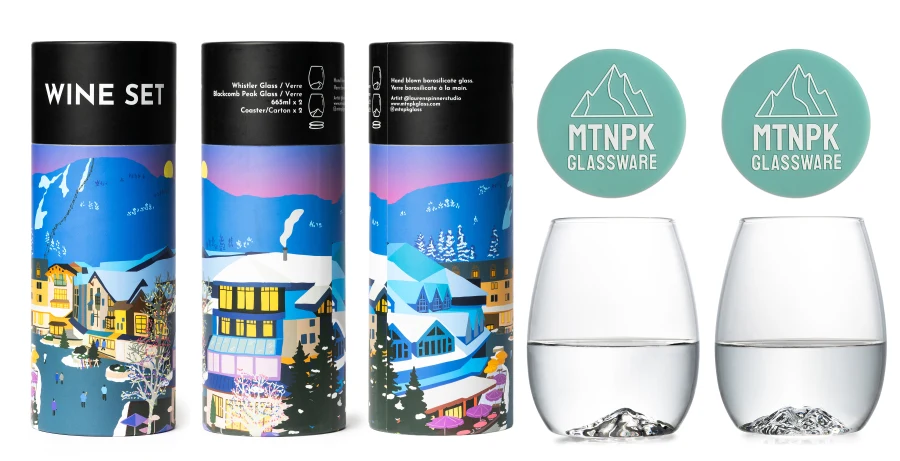A wine set display featuring three illustrated cylindrical wine bottles with black caps, two clear stemless wine glasses, and two mint green circular MTNPK Glassware coasters on a white background.