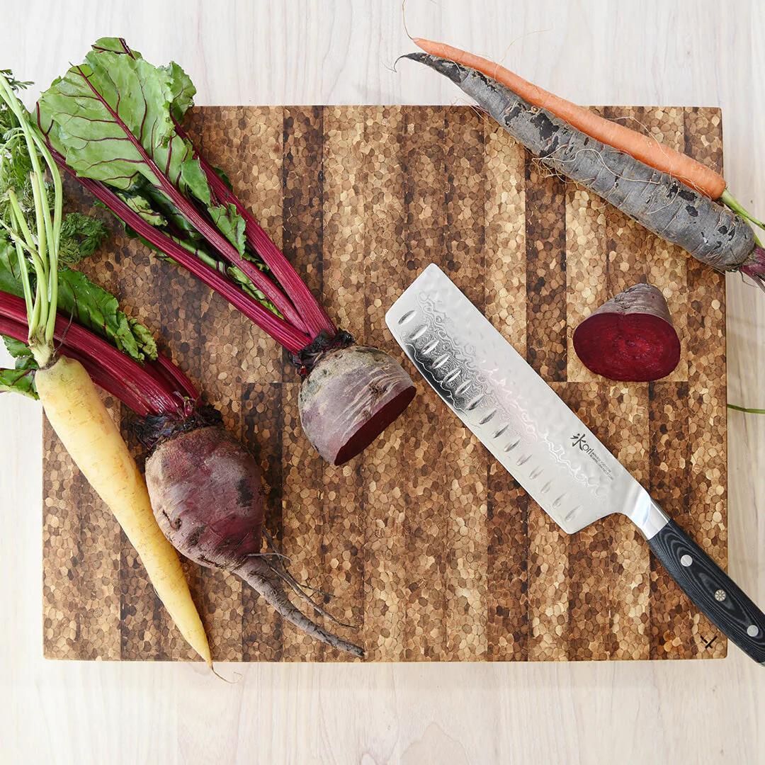 Premium end grain cutting board made in Calgary from recycled chopsticks, styled with fresh vegetables