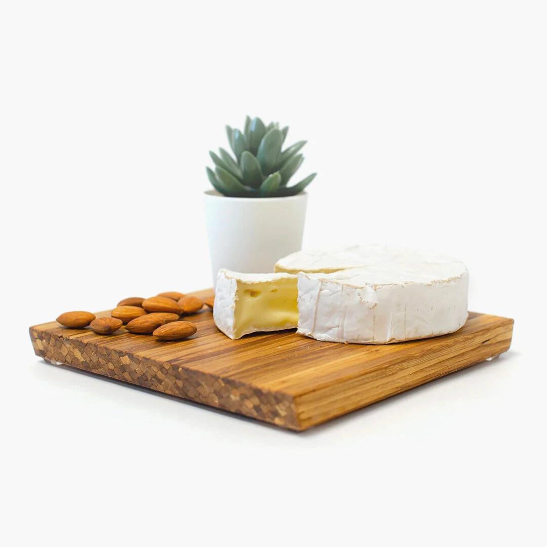 Cheese board made in Calgary from recycled chopsticks with almonds and brie