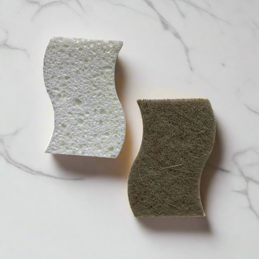Curved cellulose sponge with sisal scrubber on white marble counter – plastic-free dish sponge in Calgary by Cuprea