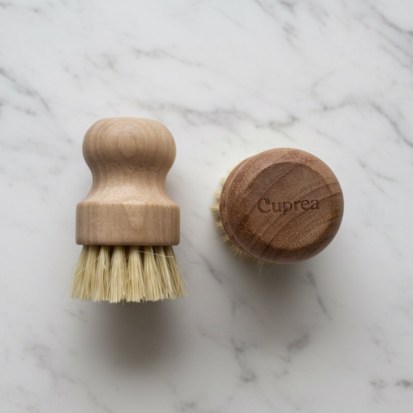 Cuprea wood dish brush with sisal bristles on white marble kitchen counter – plastic-free dish brush in Calgary
