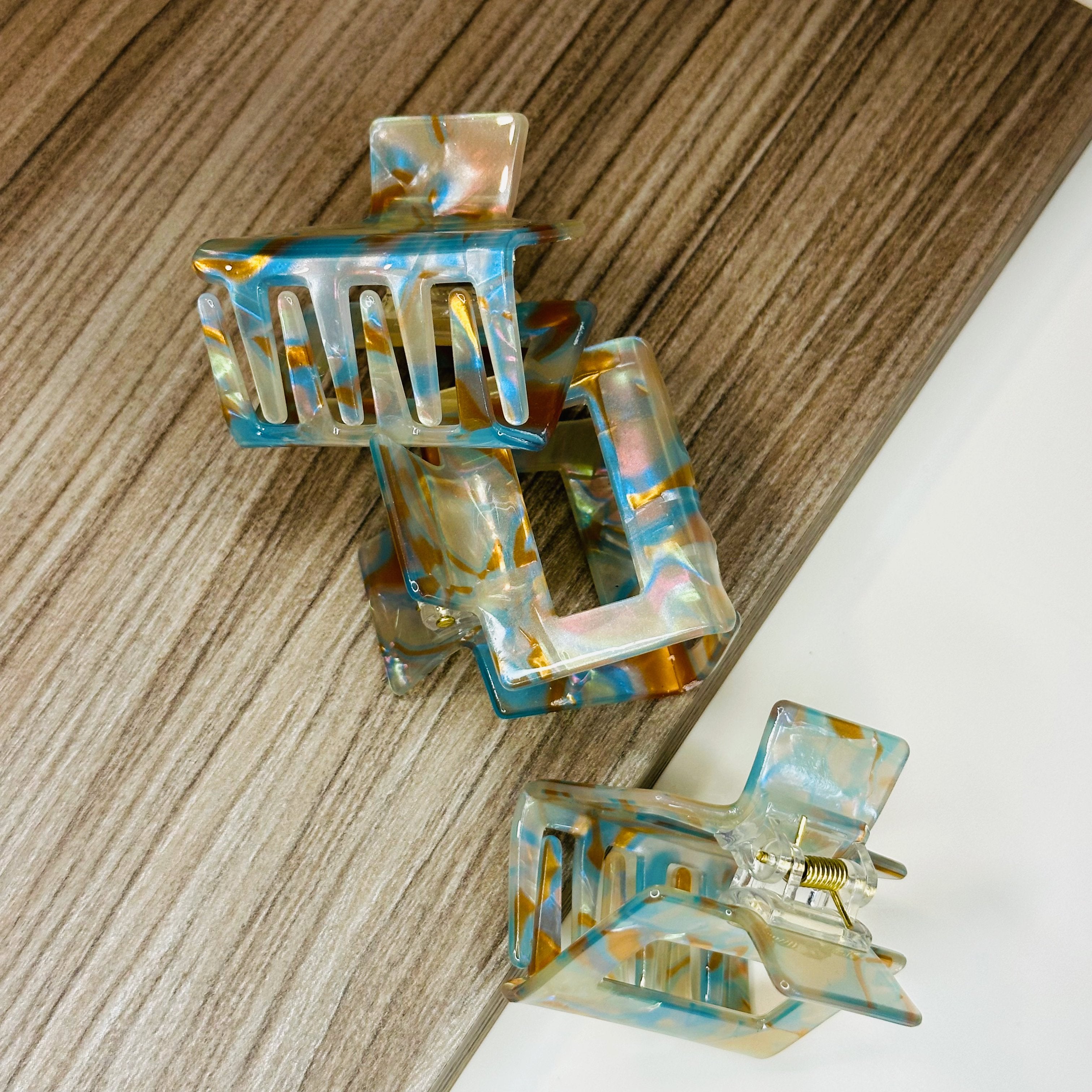 Blue and bronze marbled Evelyn hair clip – cellulose acetate accessory by Sebeana, available at Greenbriar Market in Calgary