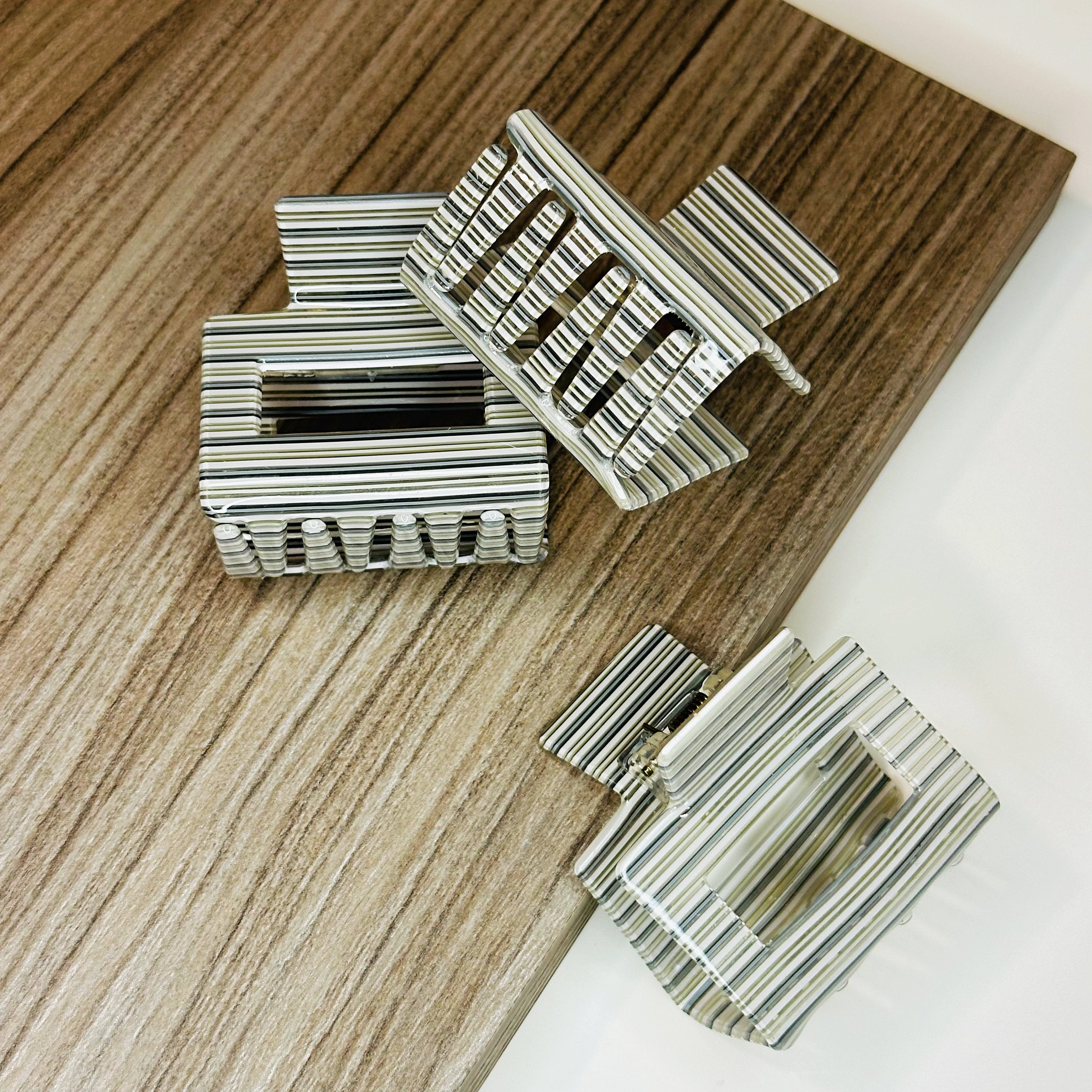 Grey striped Evelyn hair clip – cellulose acetate accessory by Sebeana, available at Greenbriar Market in Calgary