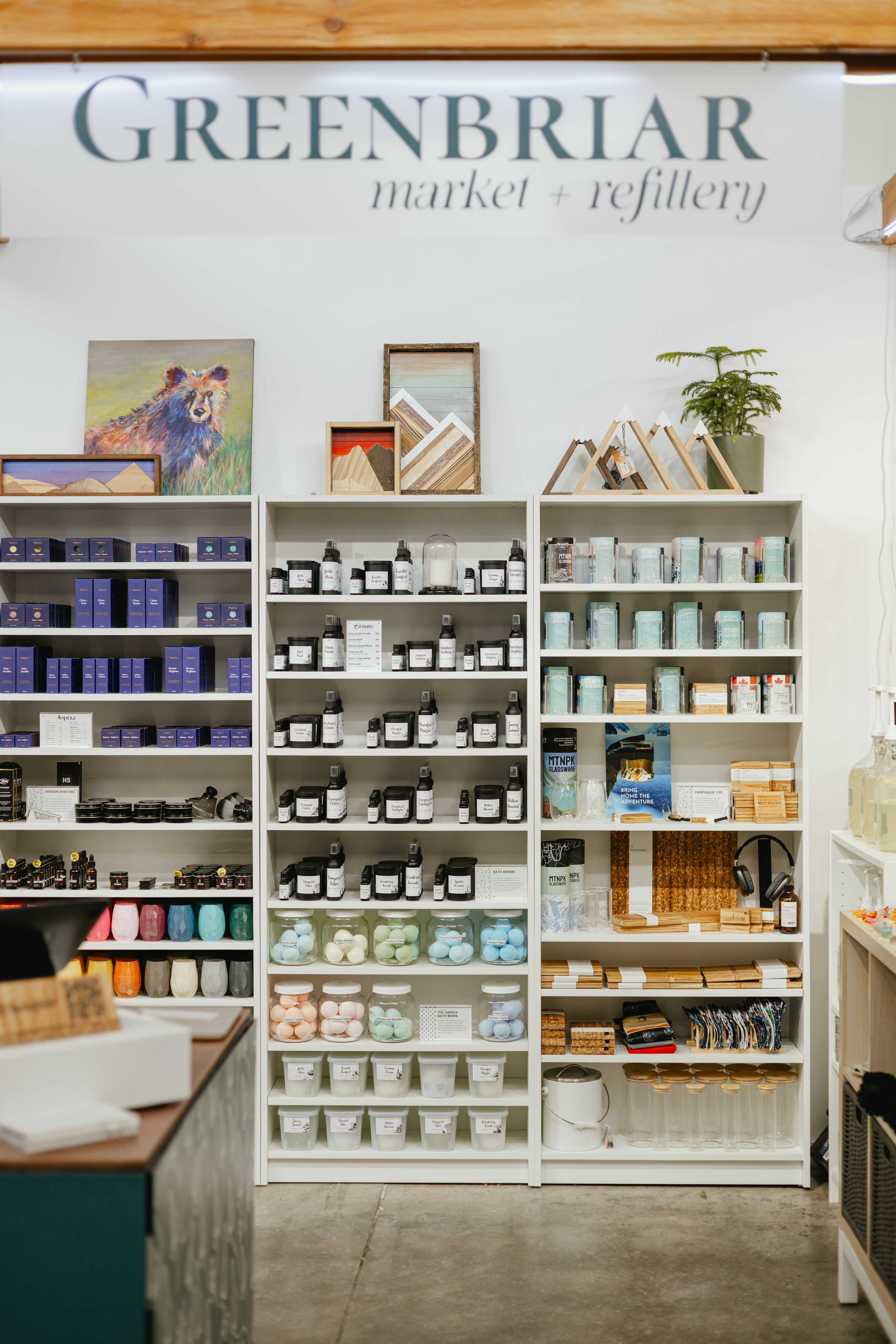 Interior shelves at Greenbriar Market + Refillery at Crossroads Market in Calgary, stocked with refillable home and body essentials