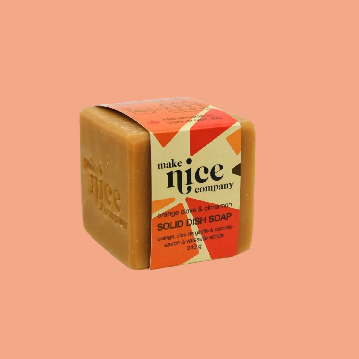 Make Nice Company Orange Clove + Cinnamon Solid Dish Soap, a brown bar with a red label on peach, Calgary zero waste