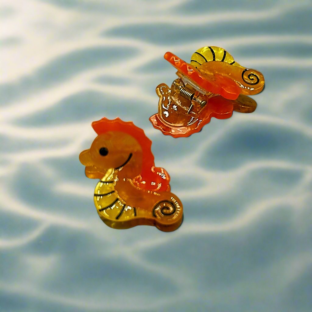 Mini seahorse hair clip in bright orange – Marina sea creature collection by Sebeana, available at Greenbriar Market