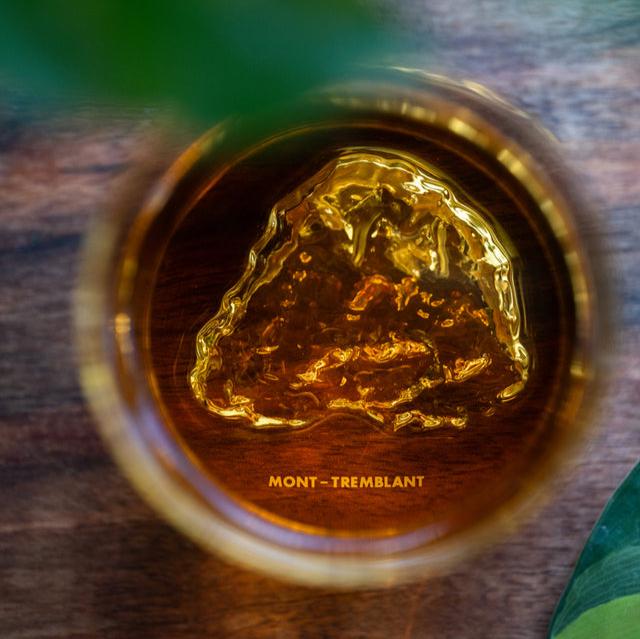 Top view of Mont Tremblant pint glass by MTNPK with amber liquid, available at Greenbriar Market in Calgary