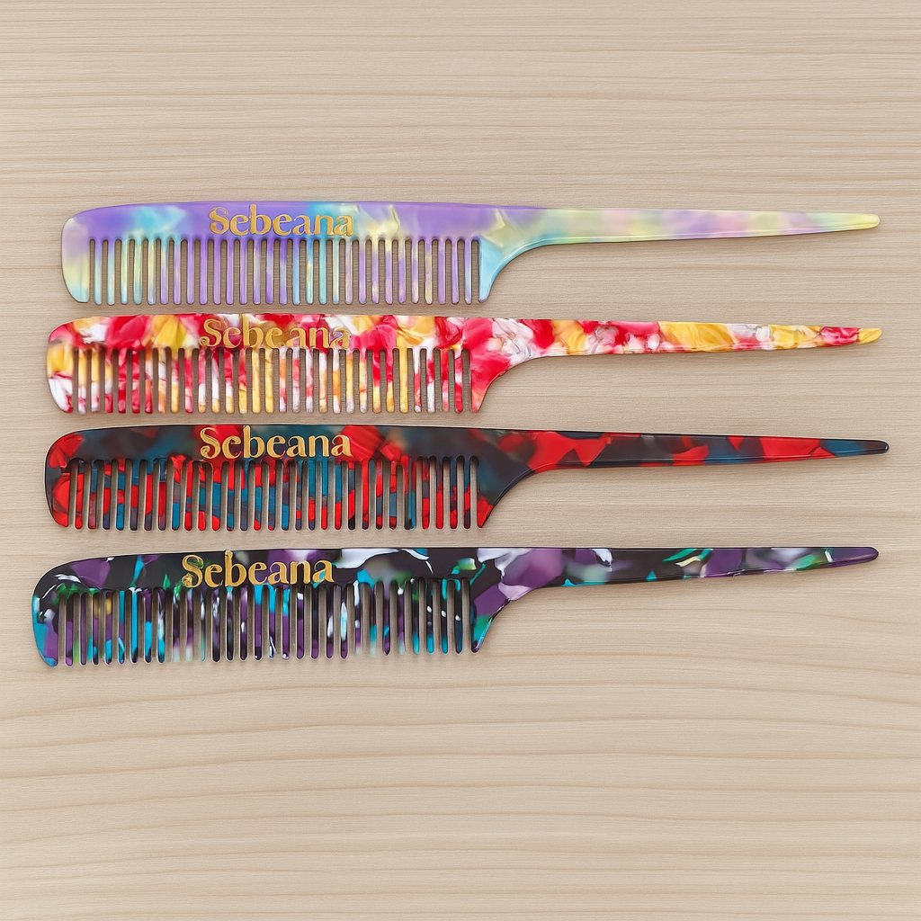 Paige Tail Combs in Aurora, Solstice, Ember, and Eclipse marbled colours on a wooden background – Calgary sustainable hair accessory