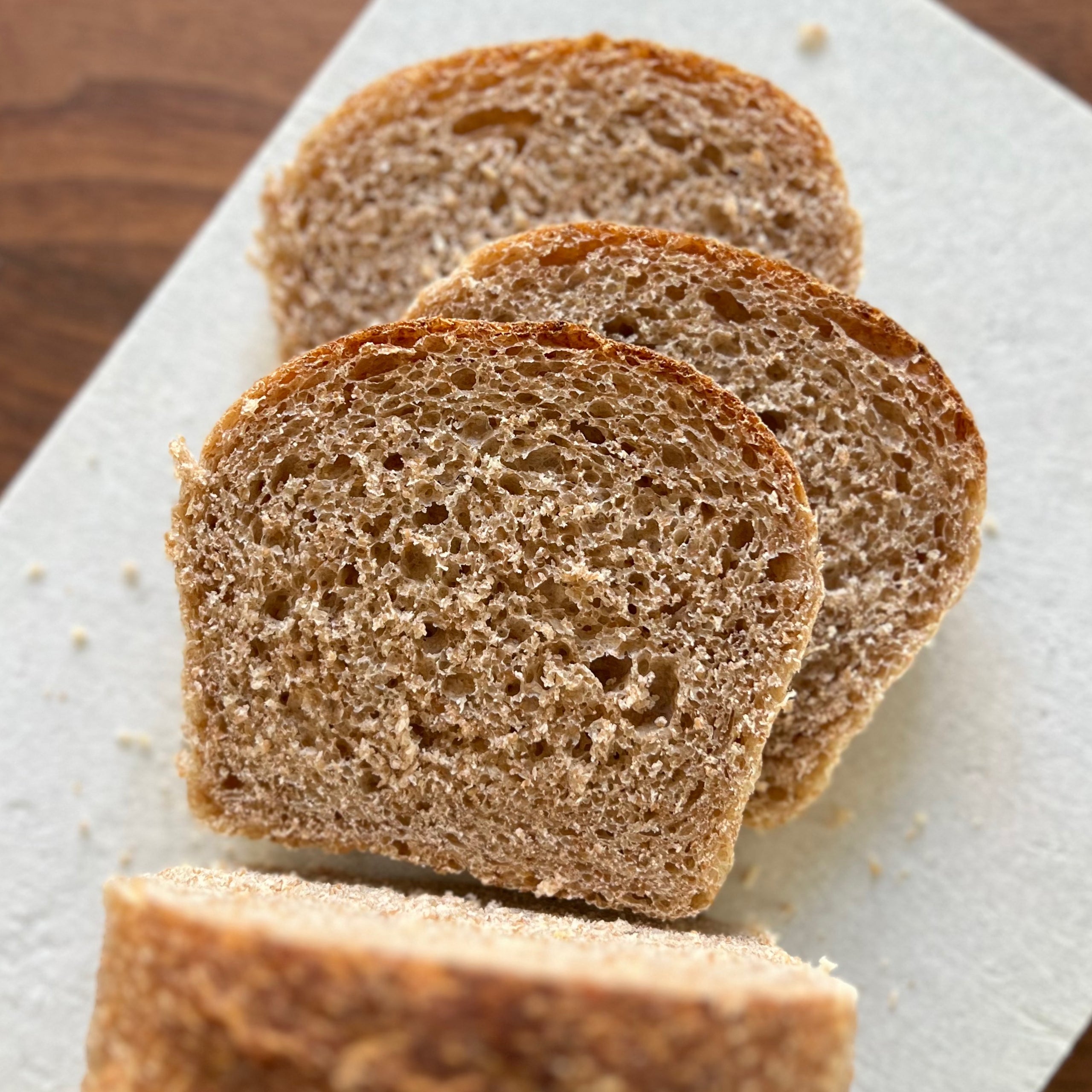 Slices of spelt sourdough from Homestead Bread in Calgary, made with ancient grains and available weekly at Greenbriar Market