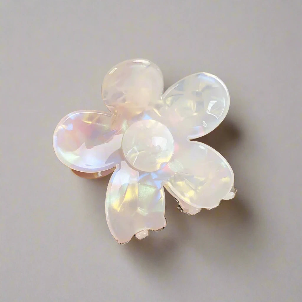 Opal daisy hair clip with iridescent shimmer on neutral backdrop – Calgary accessories by Sebeana